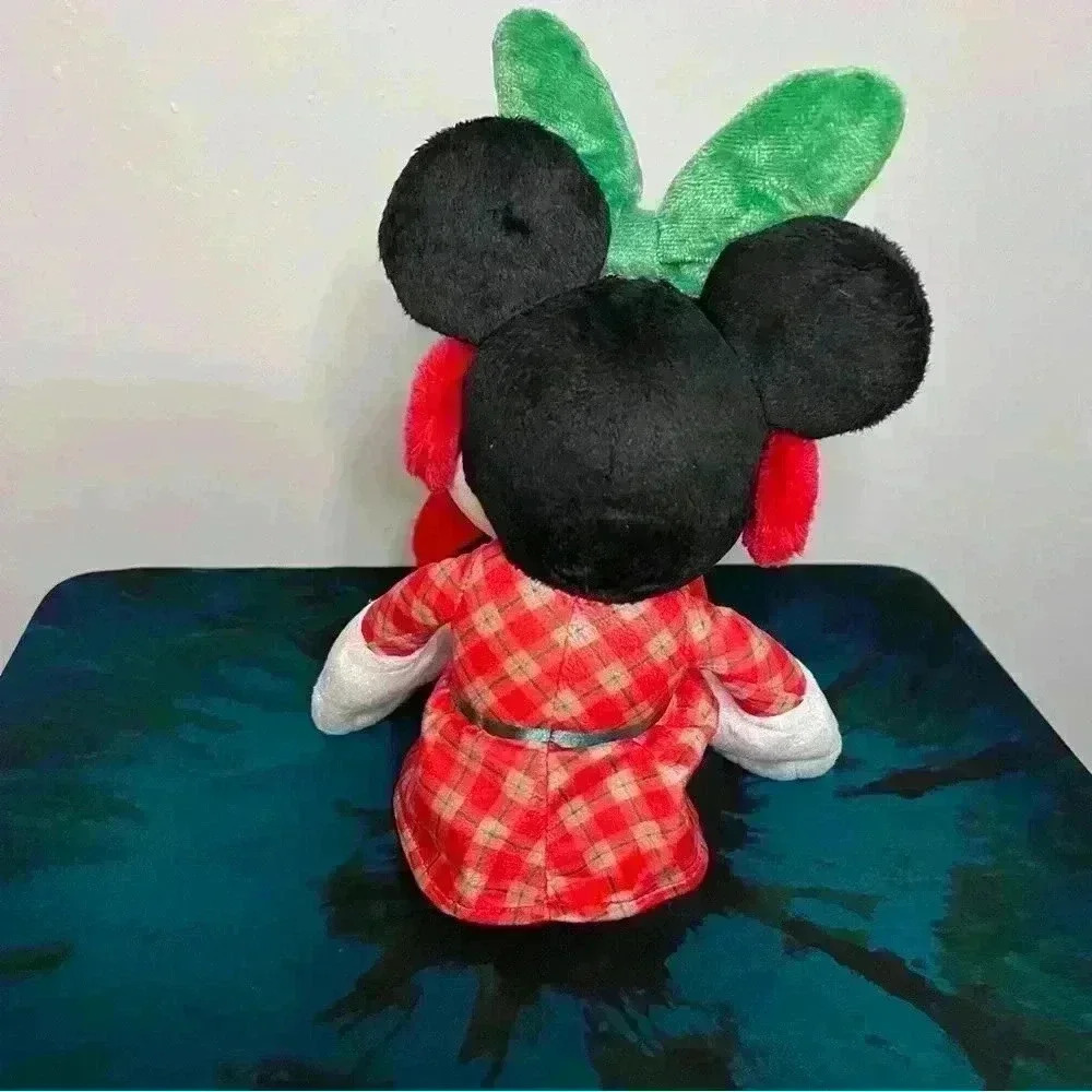 Disney Holiday Minnie Plush with green bow & red ear muffs.  16 1/2” high. - Picture 2 of 3